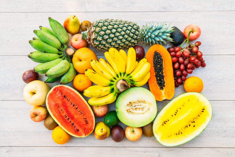 A variety of fruits are shown, which are ideal to eat when you're sick for calories as well as healthy nutrients.