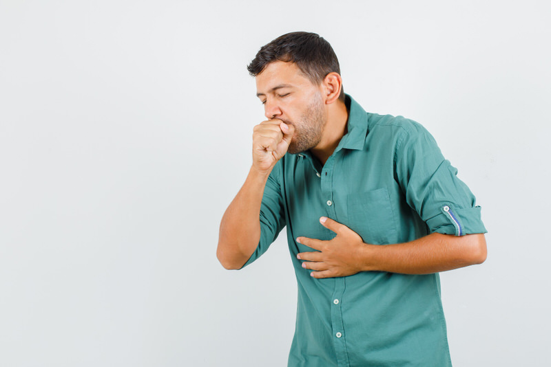 A man is coughing up clear jelly balls, indicating that he has mucus build up.