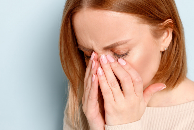 A woman is in pain after one of her contact lenses went behind her upper eye lid.