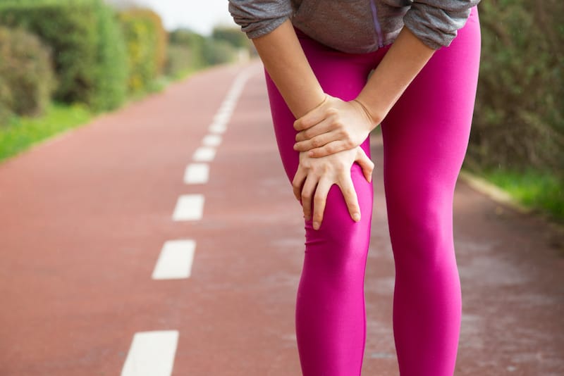 A woman stopped her jog because she's feeling a numbing sensation by her knee