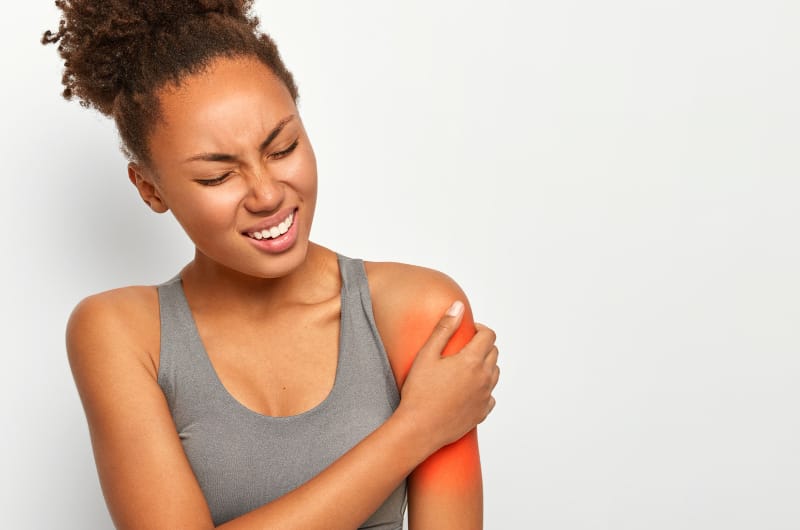 A woman is feeling swelling pain on her left arm after working out