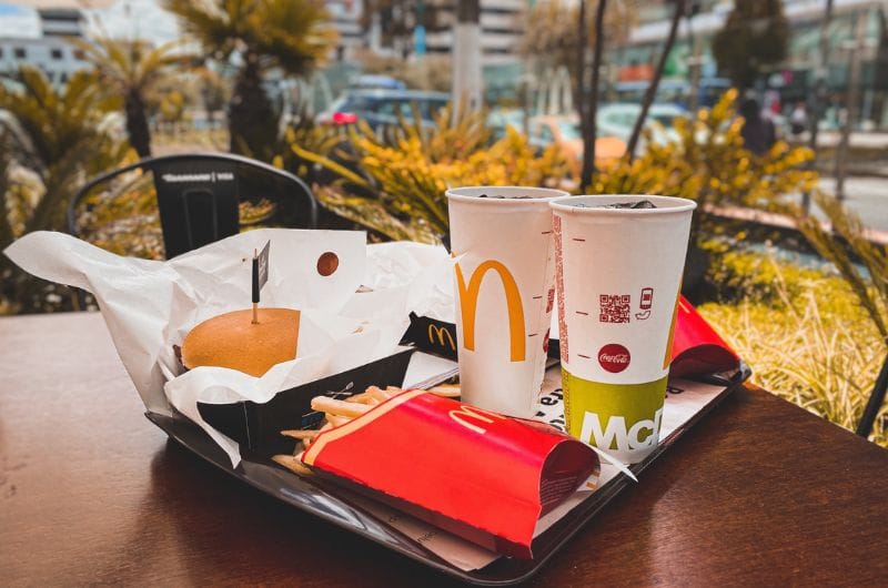 A tray of drinks and foods ordered from McDonald's