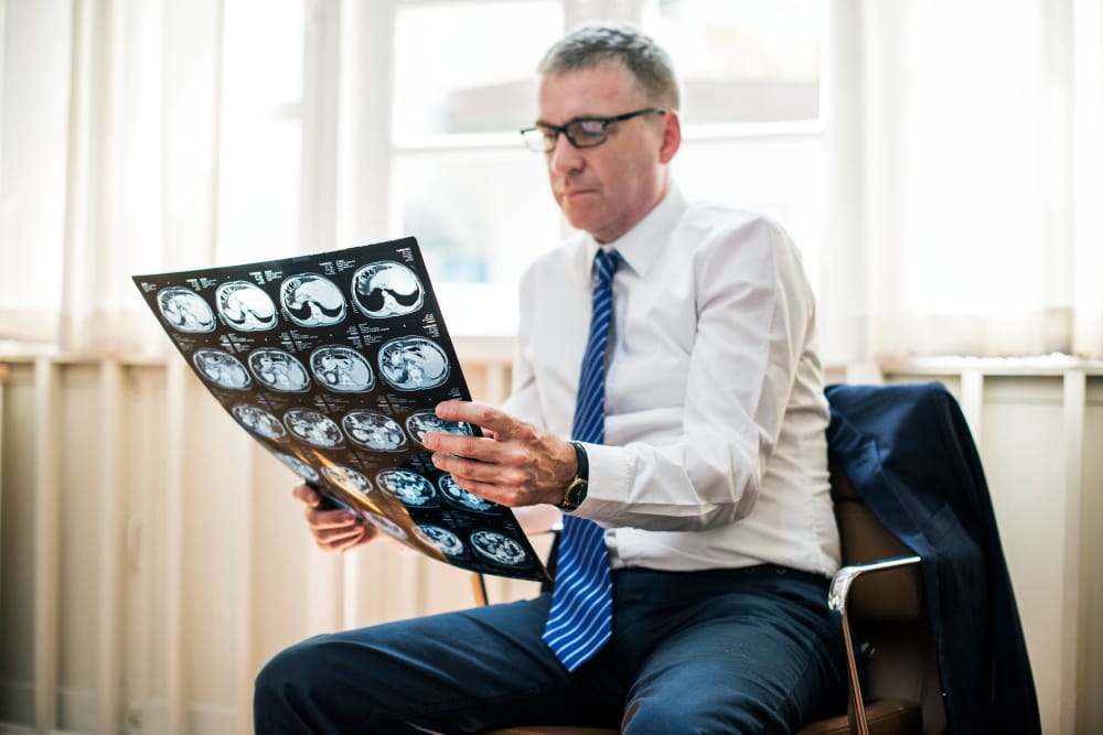 A doctor is reviewing a recent MRI scan of his patients brain to check for a possible aneurysm